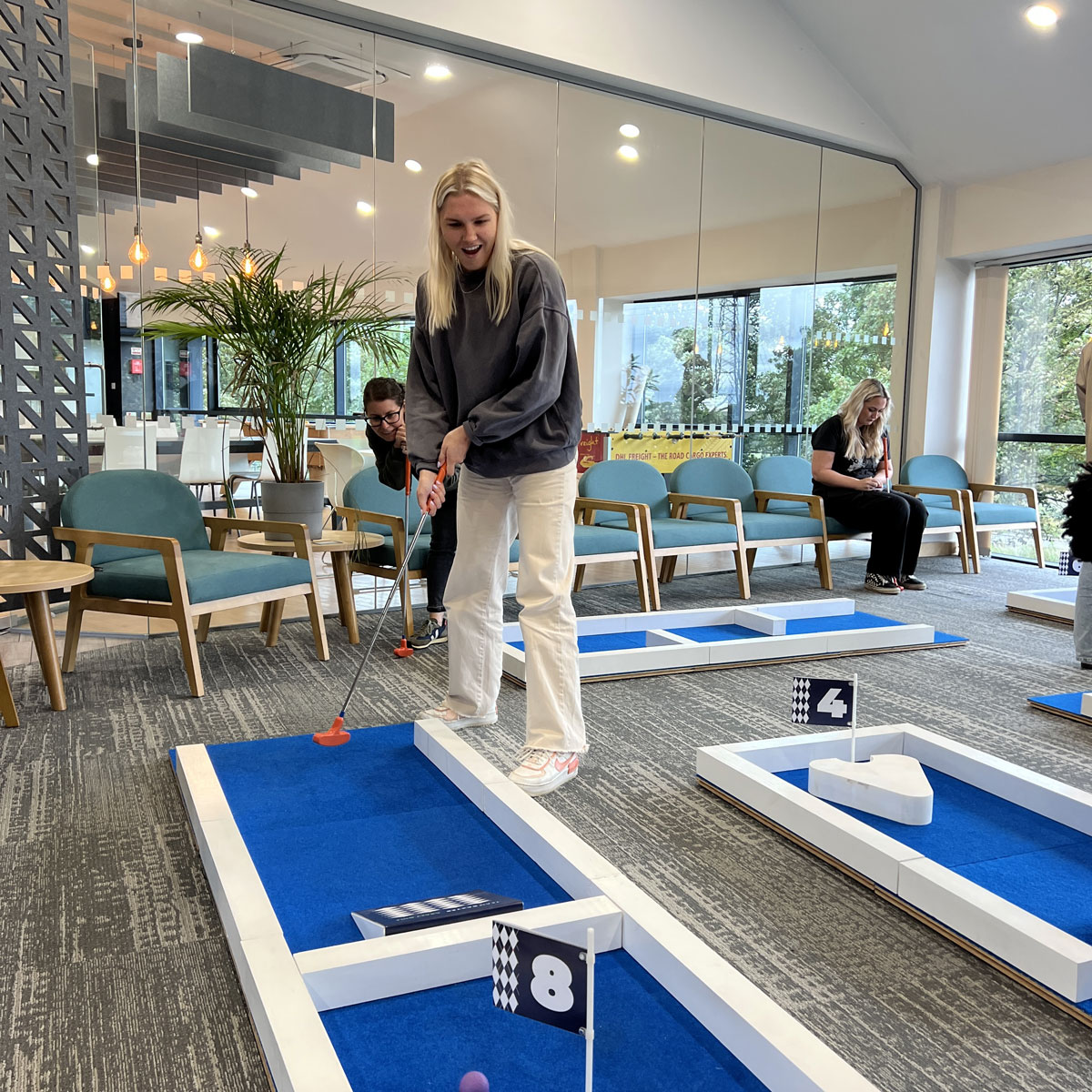 Team bonding with a portable crazy golf course at the office