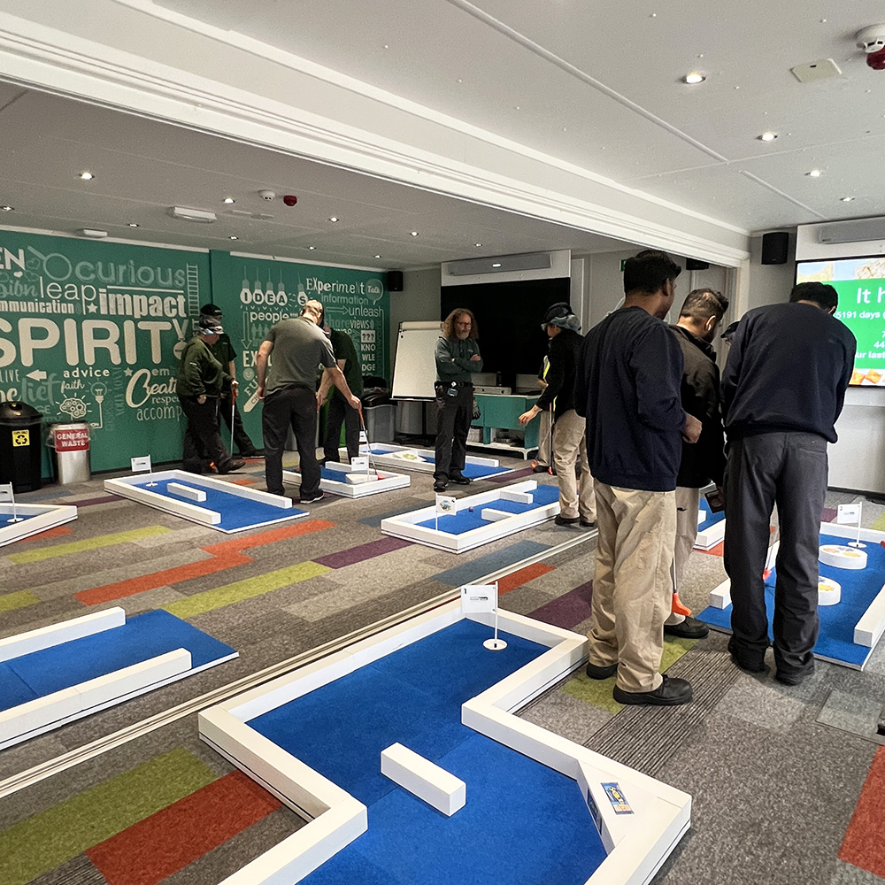 Portable Foods colleagues enjoying an office mini golf event